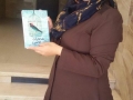 Hanaa Shalabi receives a copy of TPD in which she is featured. Shalabi went on hunger strike and she was later deported to the Gaza Strip #TPD.jpg