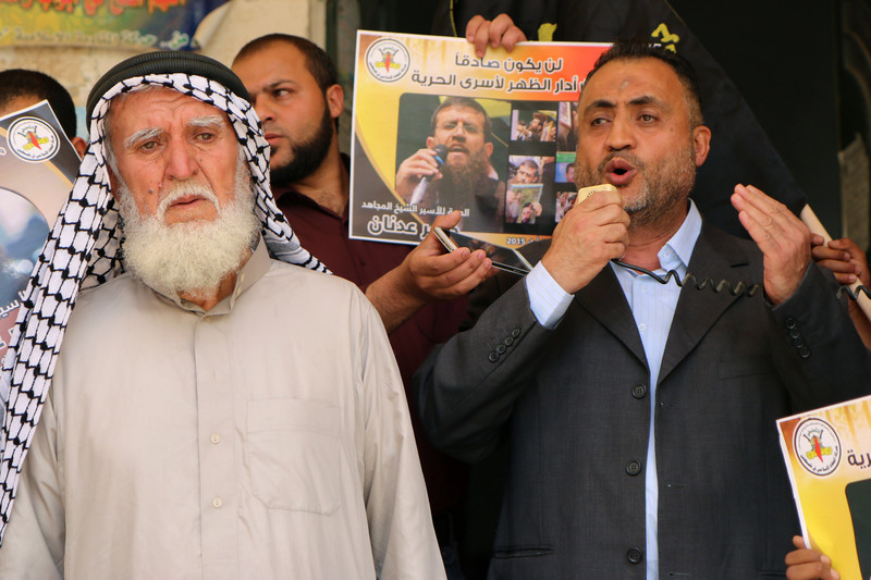 Adnan Mousa, left, attends a 23 May rally in Arrabeh village in the occupied West Bank, in solidarity with his son Khader Adnan who is on a total hunger strike against his administrative detention by Israel. Ahmad Al-Bazz ActiveStills