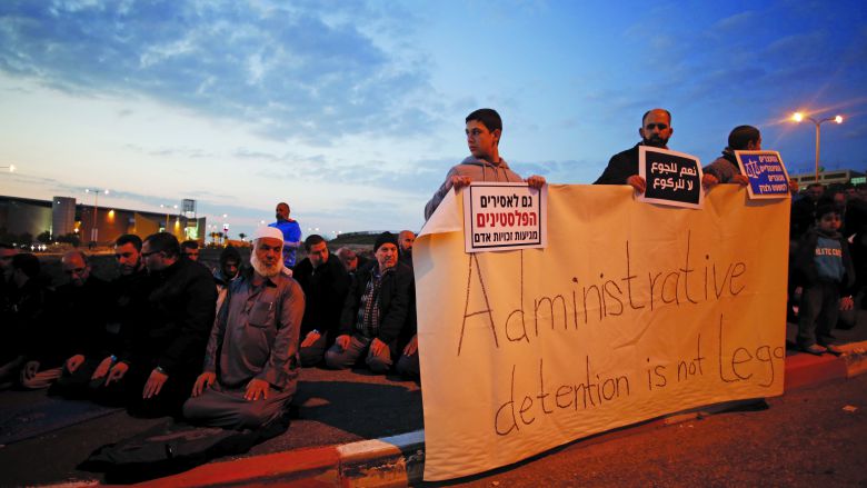 Demonstrators call for the release of Palestinian journalist Mohammed Al Qeq, outside Haemek hospital, February 9. Qeq, 33, is reported to have been on the world’s longest hunger strike to protest at his administrative detention in an Israeli jail. REUTERS/Baz Ratner 