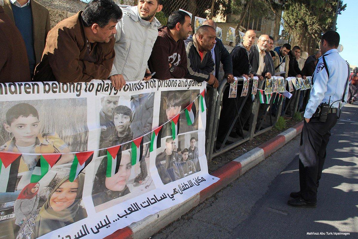 Palestinians take part in a protest to show solidarity with Palestinian children who have been arrested and held by Israeli forces [Mahfouz Abu Turk/Apaimages]