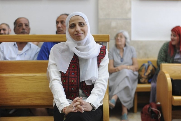 Dareen Tatour sits in a courtroom in Nazareth, Israel (AP)