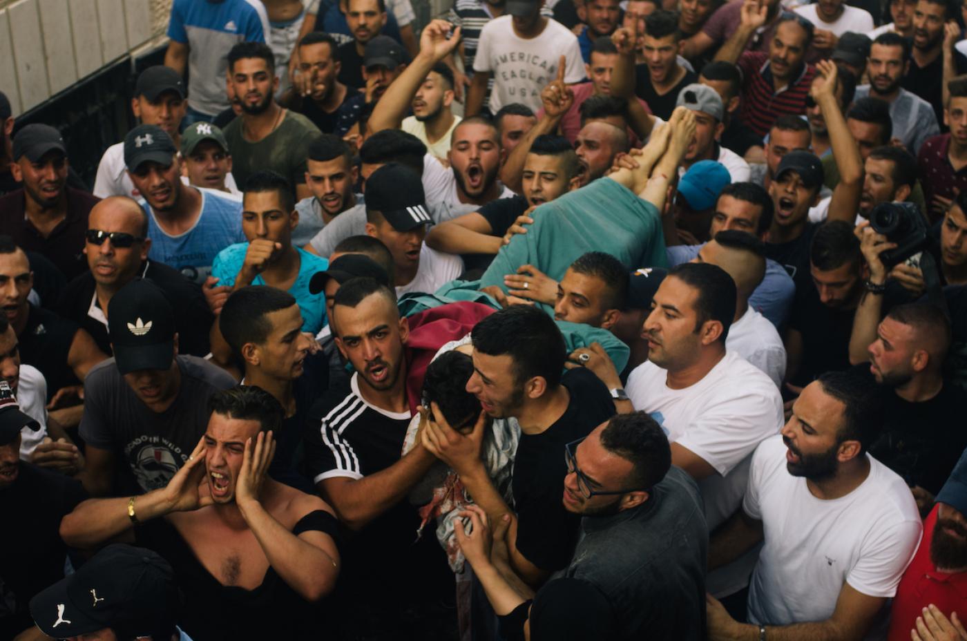 Friends rushed to bury Mohammed Abu Ghanam in July 2017 before his body could be confiscated by Israeli forces (MEE/Kaamil Ahmed)