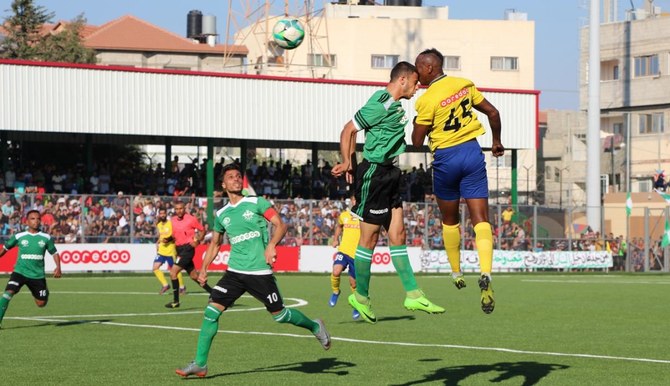 Rafah Club and Balata Youth Center team players in action during the Palestine Cup match in the southern Gaza Strip city of Rafah last month. (Supplied)