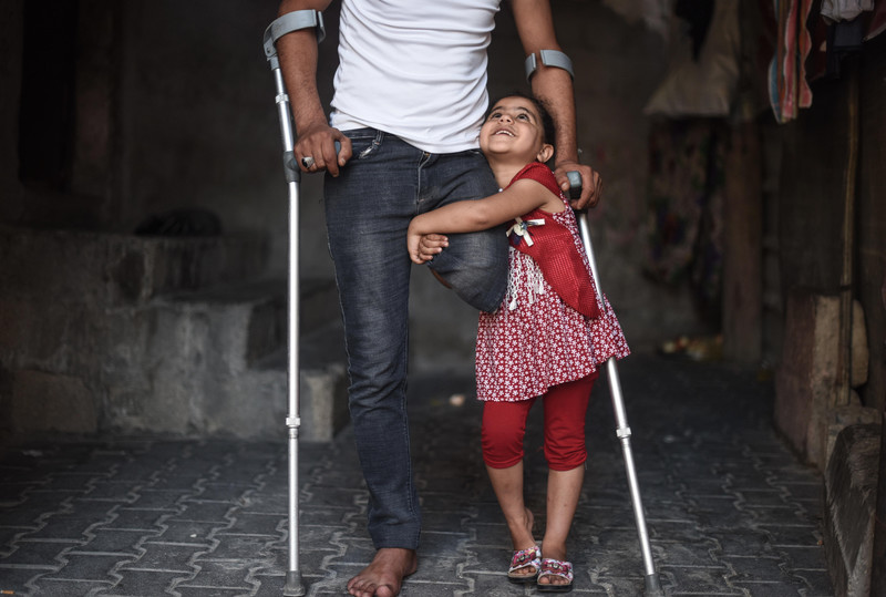 Bassam Abu Obaid with his daughter Ibtisam. Abed Zagout