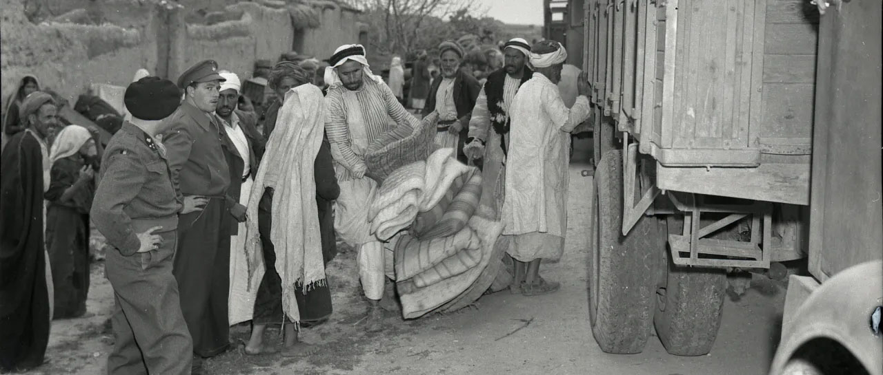 International forces overseeing the evacuation of Iraq al-Manshiyya, near today's Kiryat Gat, in March, 1949. Collection of Benno Rothenberg/Israel State Archives