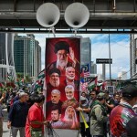 Protestors shows portraits of Iran's slain supreme leader Ayatollah Ali Khamenei and others killed during US and Israeli strikes on Iran during a demonstration to mark al-Quds (Jerusalem) Day, in Kuala Lumpur on March 13.